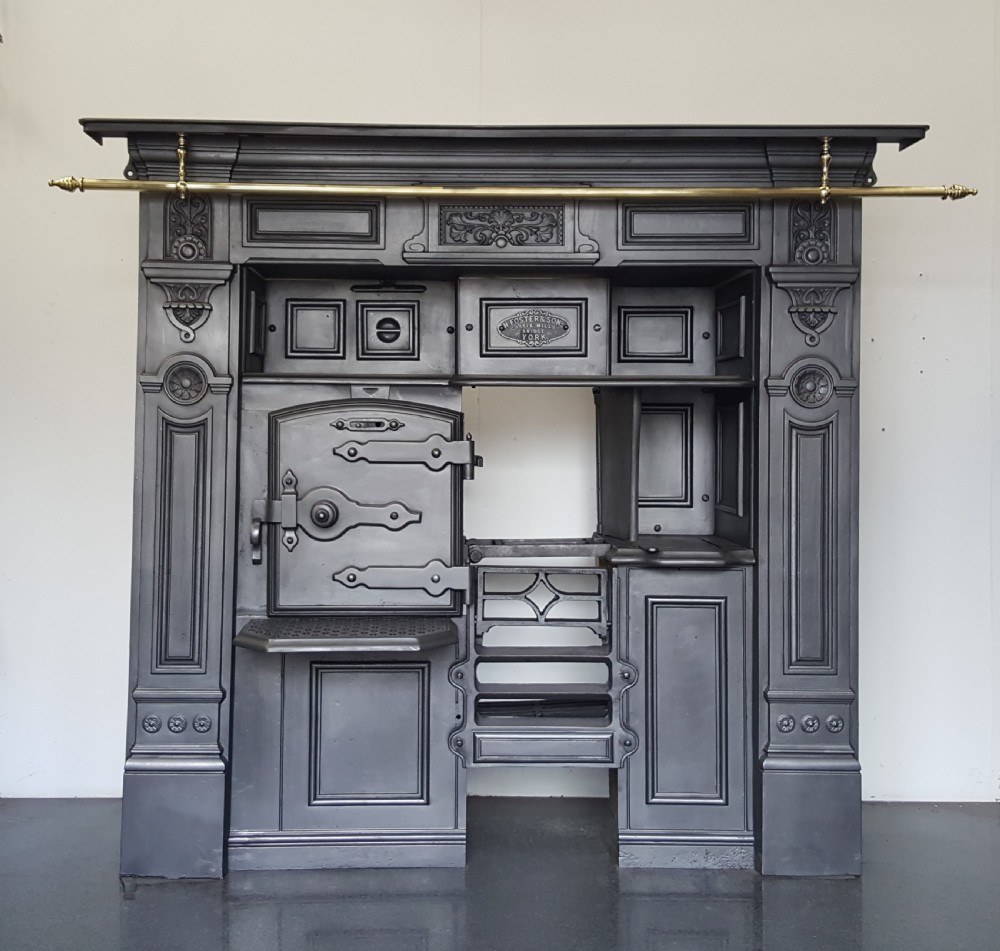 cast iron victorian cooking range complete with brass pots hanging rail