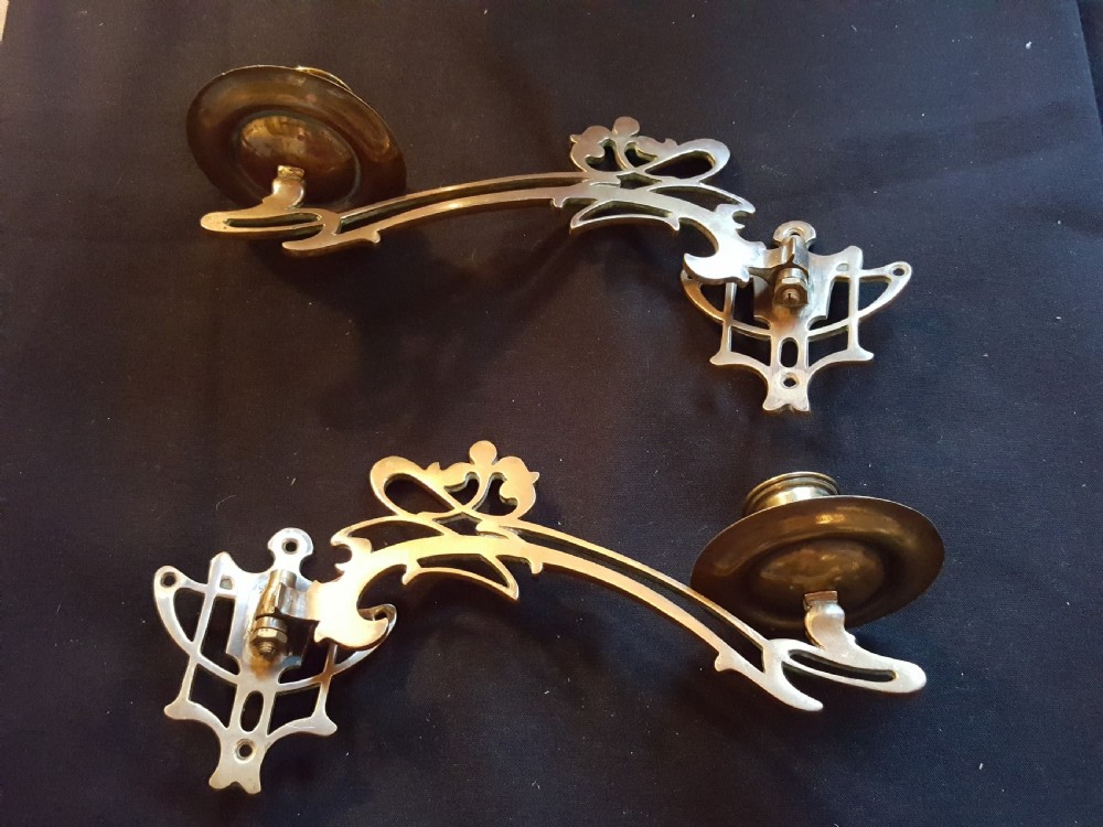 one pair of bronze art nouveau candle sconces