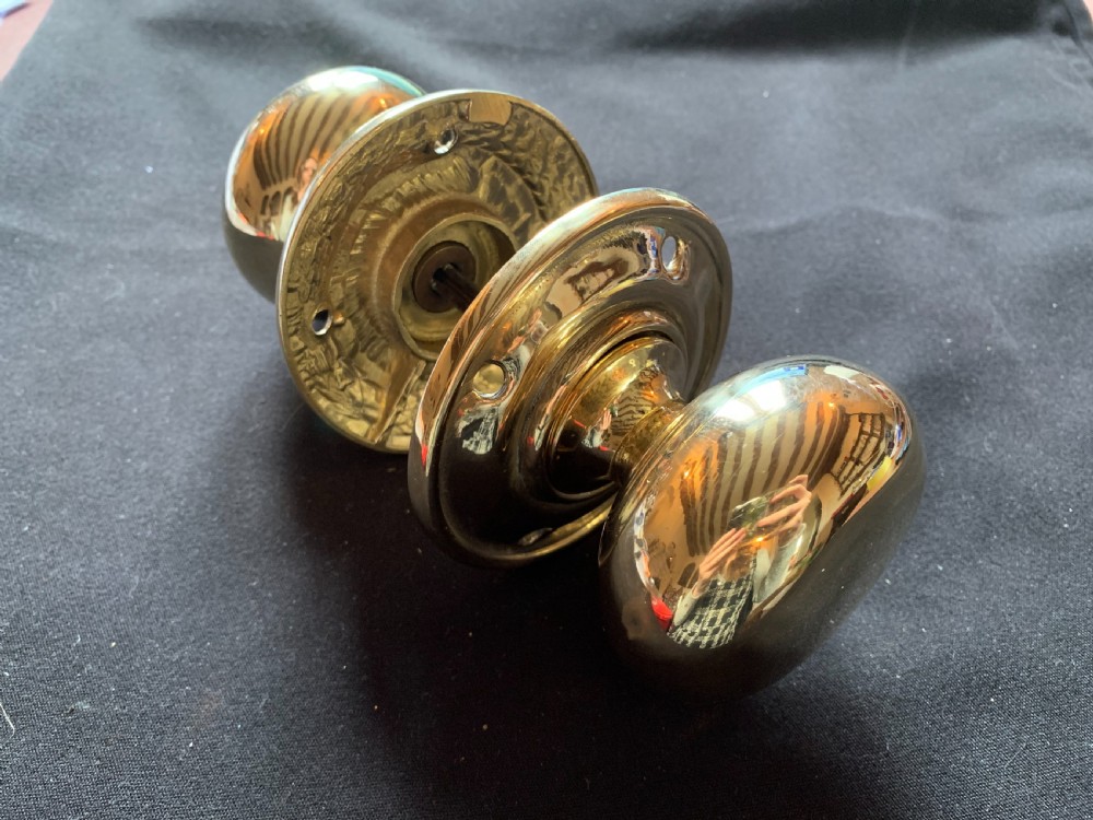 one pair of brass georgian door knobs