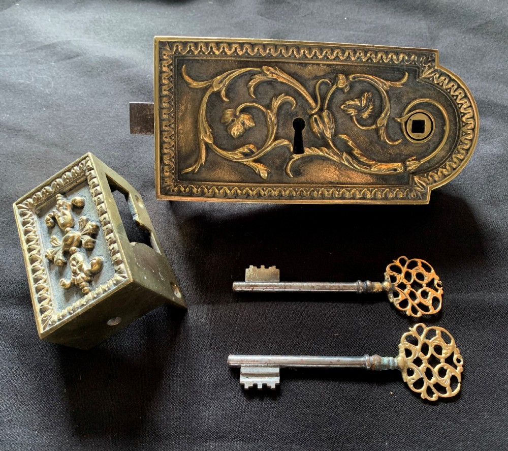 one brass french victorian lock with two keys