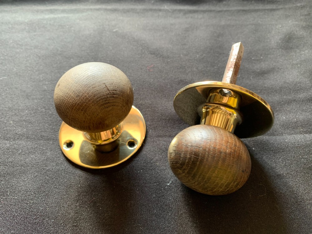 one pair of brass wooden victorian door knobs