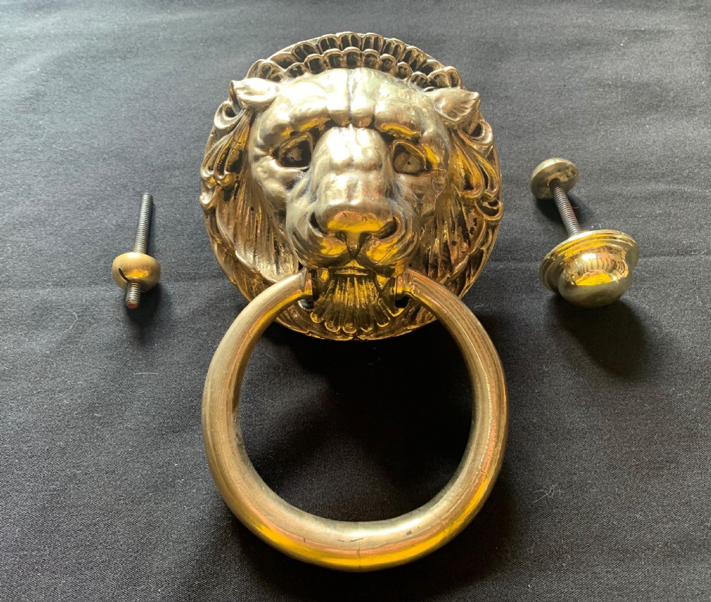 one large brass victorian lion head door knocker