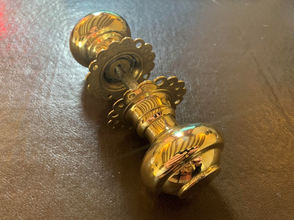 one pair of brass georgian door knobs