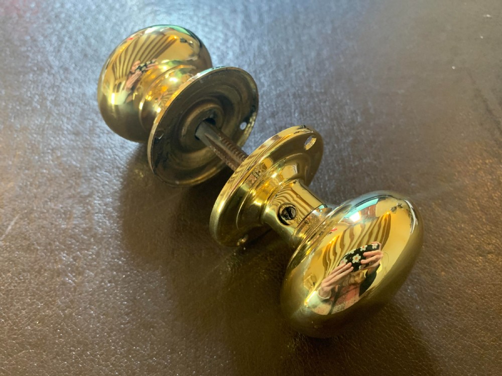 one pair of brass georgian door knobs