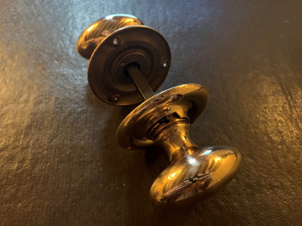 one pair of bronze edwardian oval door knobs